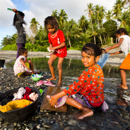 children-gathering-at-ocean-shoreline