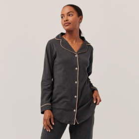 Woman wearing gray Pact sleepwear set